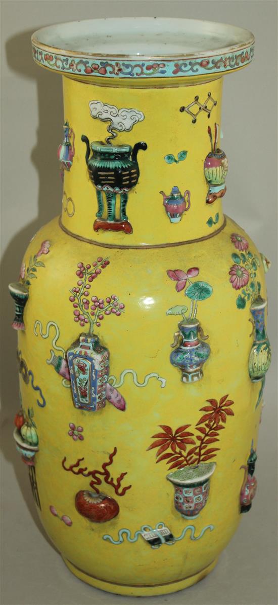 A large Chinese yellow ground and moulded Hundred Antiques vase, 19th century, 44cm